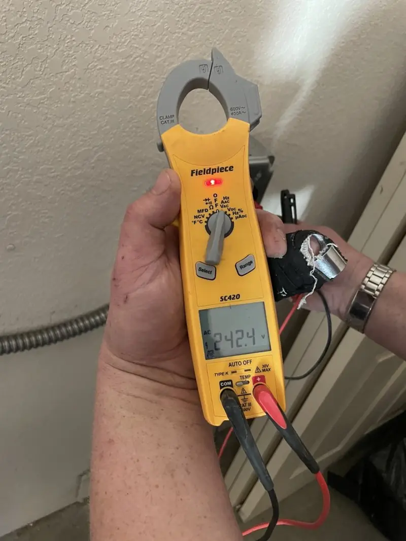 Voltage testing with clamp meter during Electrical Installation Services in Fairfield